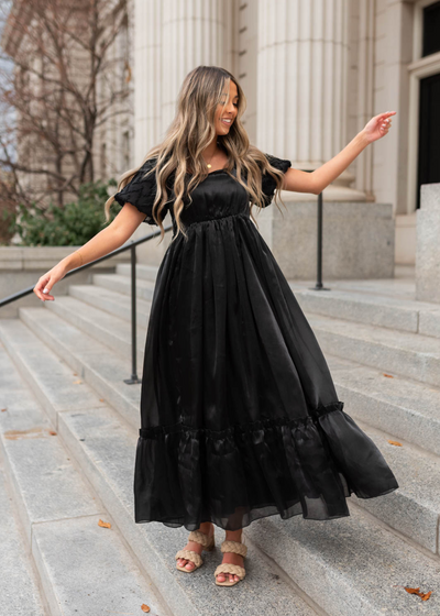 Short sleeve black organza dress with ruffle at the hem