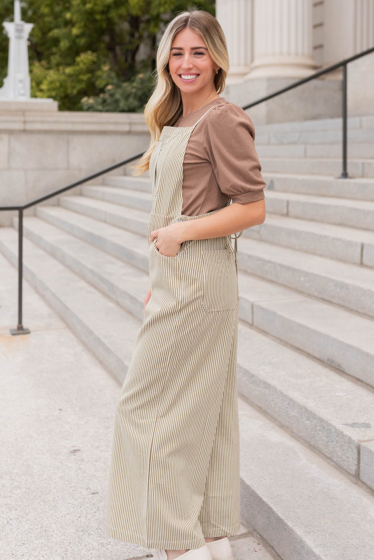 Side view of the olive stripe overalls