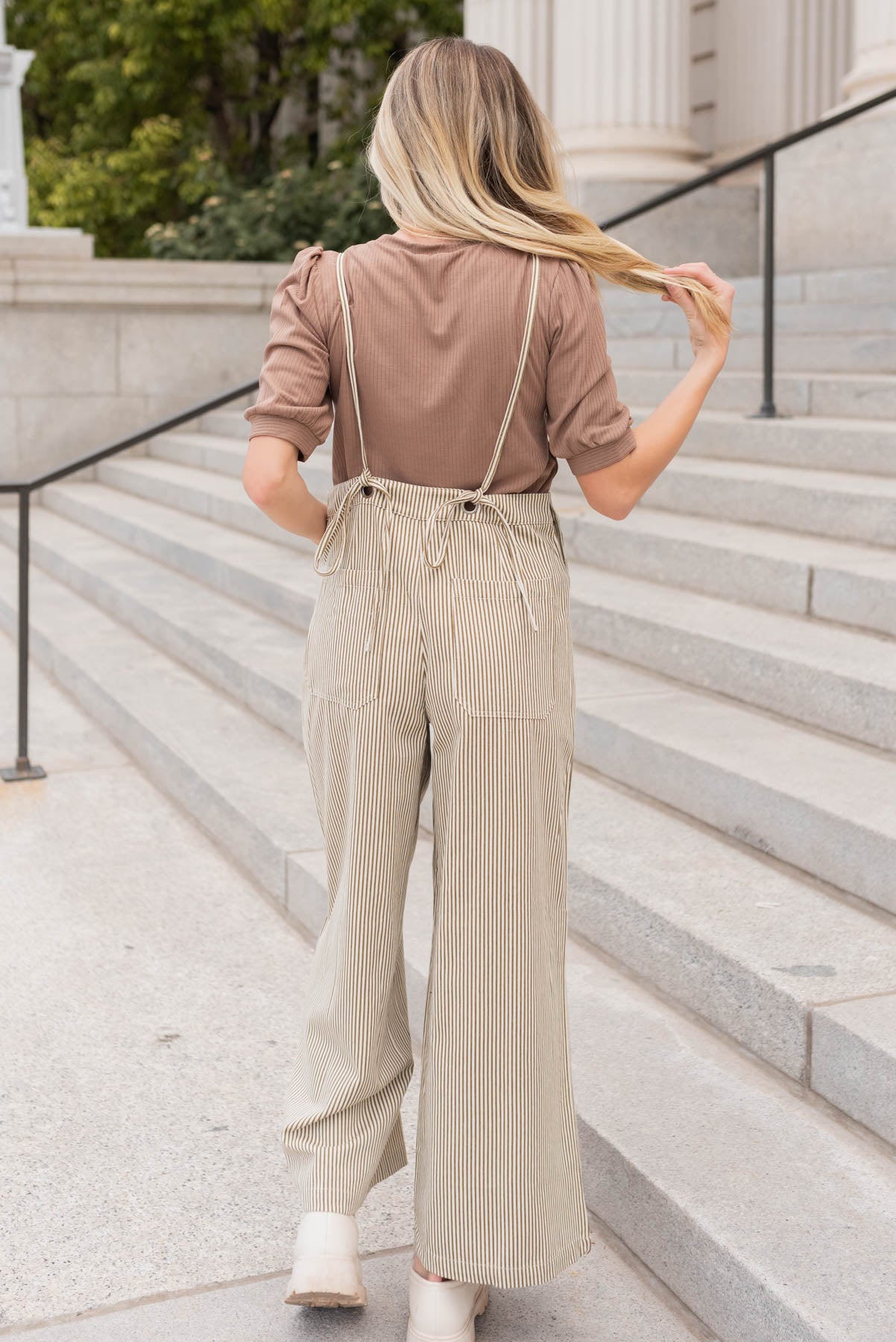 Back view of the olive stripe overalls