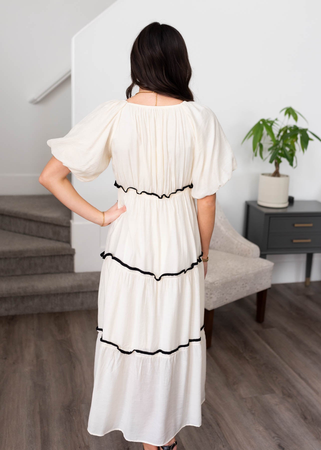 Back view of the cream ruffle tiered dress