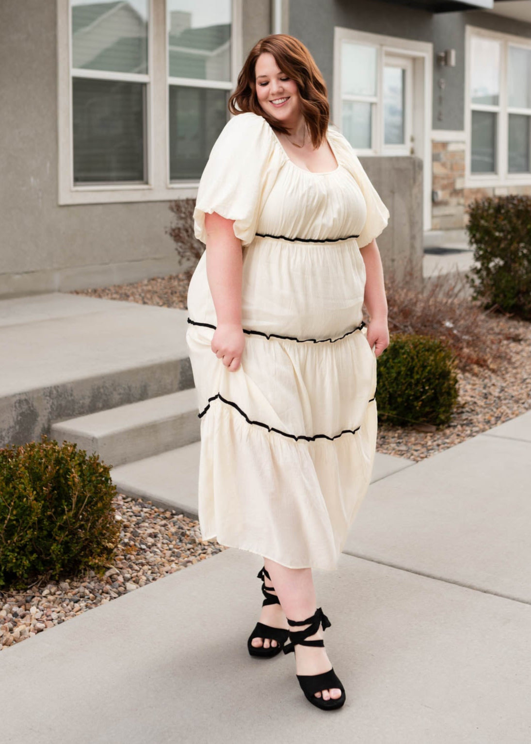 Short sleeve cream ruffle tiered dress with black trim in plus size