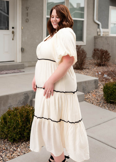 Side view of the cream ruffle tiered dress in plus size