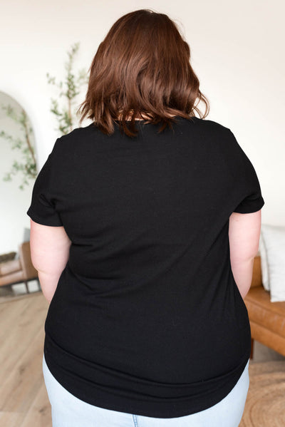 Back view of the plus size black ribbed top