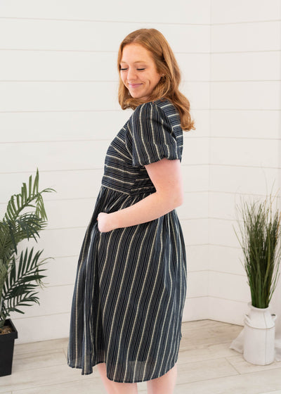 Side view of the navy jacuard stirpe dress