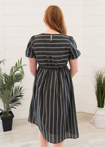 Back view of the navy jacquard stripe dress