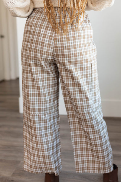 Back view of the coffe plaid pants