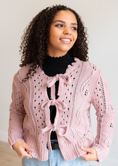 Lacey knit pattern on pink open tie cardigan