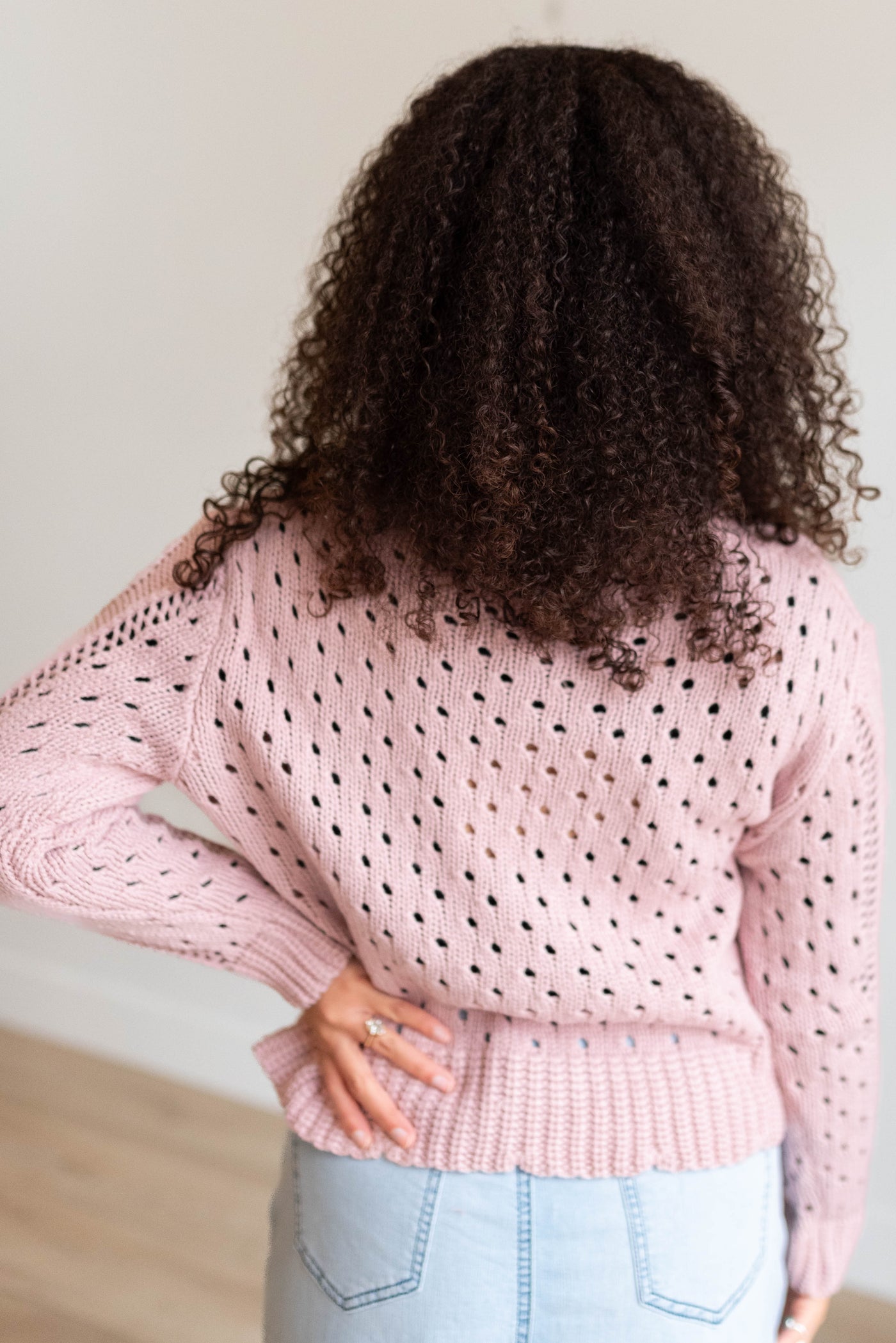 Back view of the pink open tie cardigan