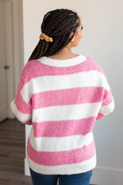 Back view of the pink stripe sweater