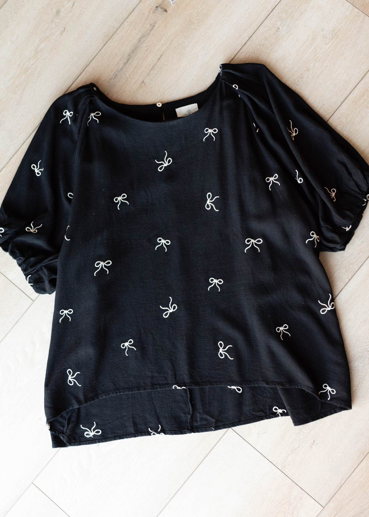 Black embroidered bow top