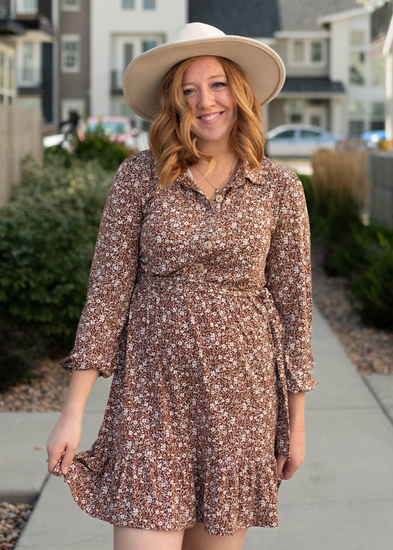 Brown floral dress with buttons on the bodice