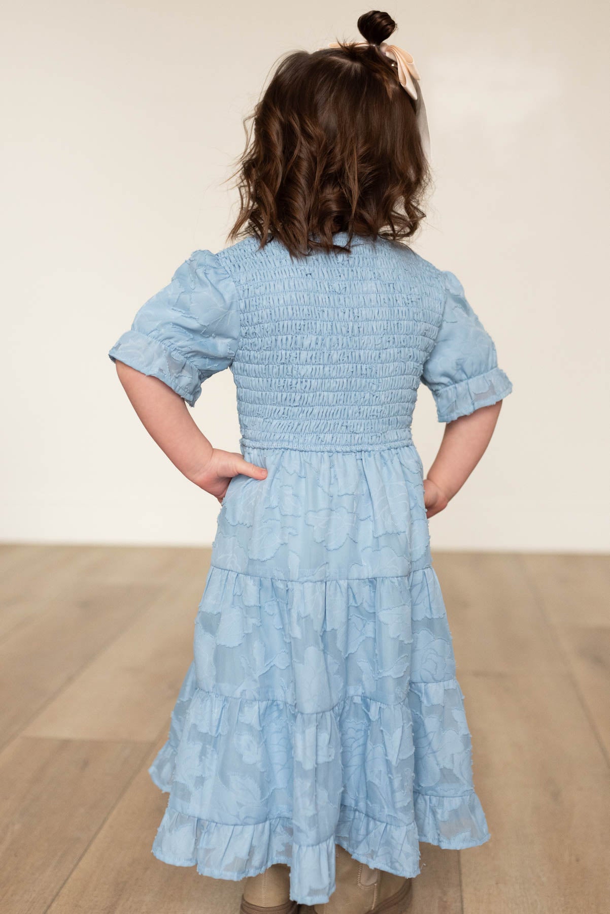 Back view of the blue floral tiered little girl dress