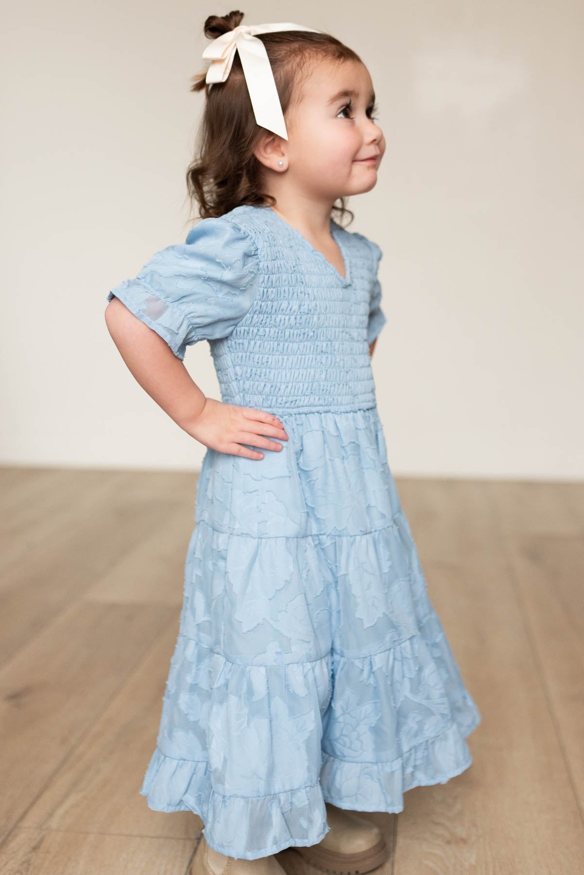 Side view of the blue floral tiered little girl dress