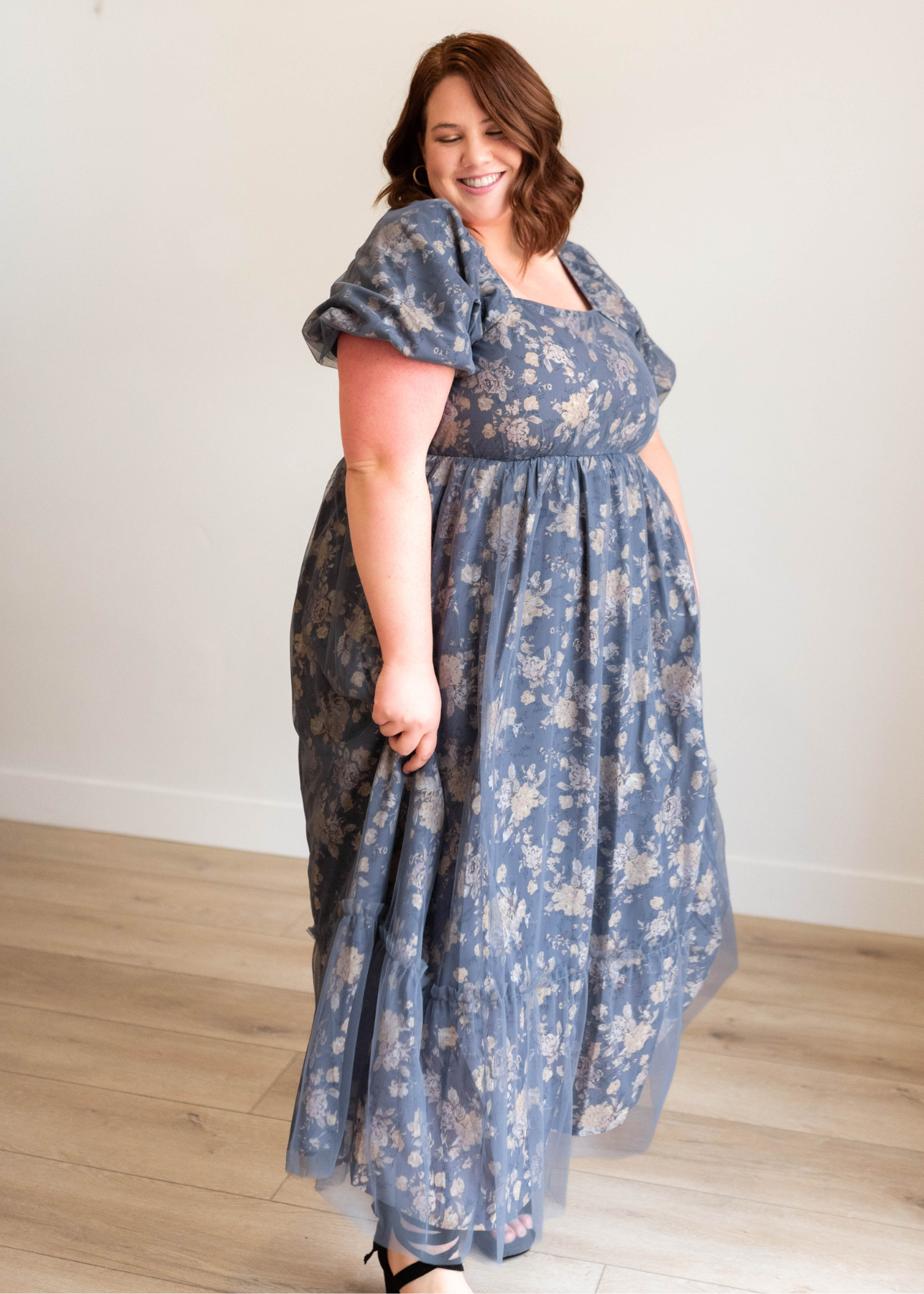 Puff sleeve on the navy multi floral dress in plus size