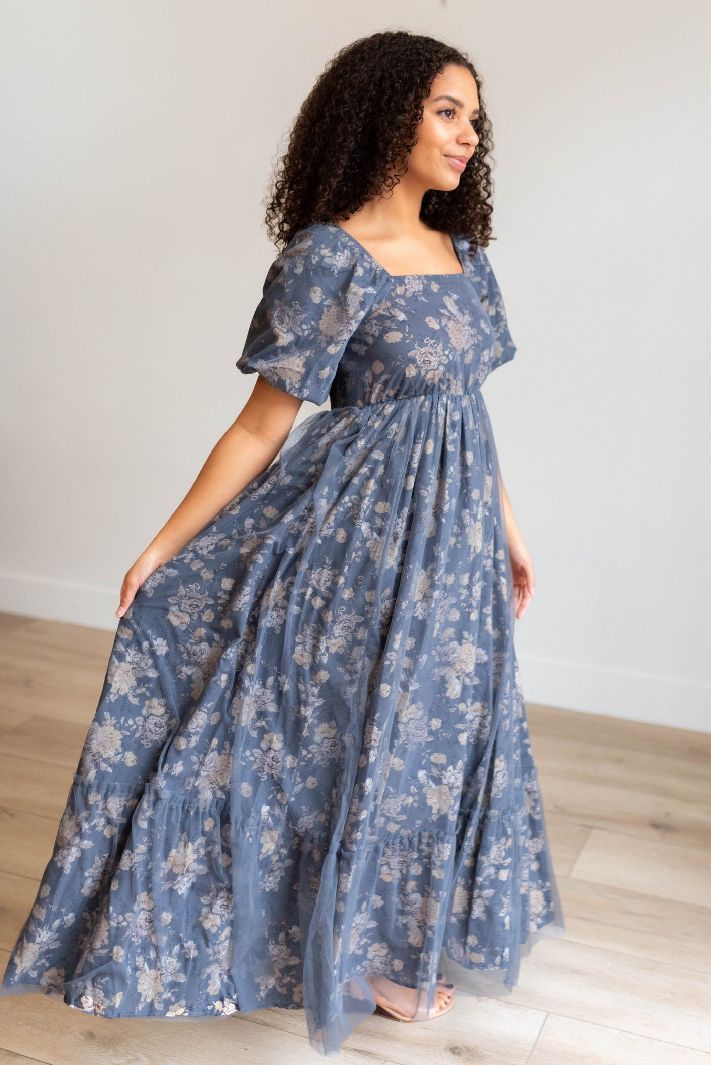 Side view of the navy multi floral dress