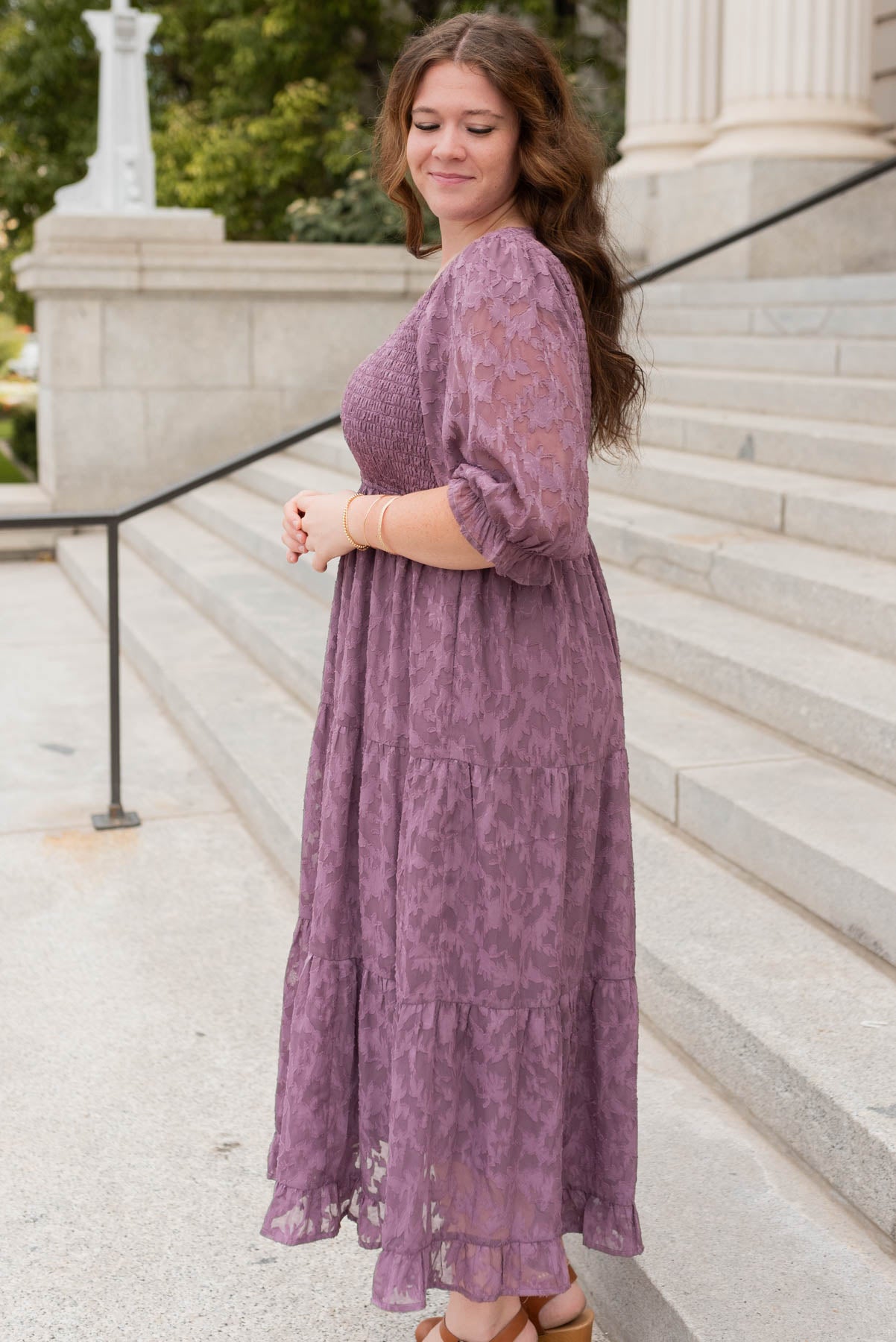 Side view of teh purple floral dress in plus size