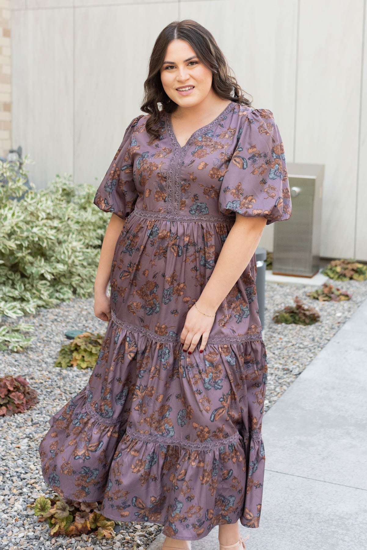 Plum floral tiered dress with a v-neck in plus size