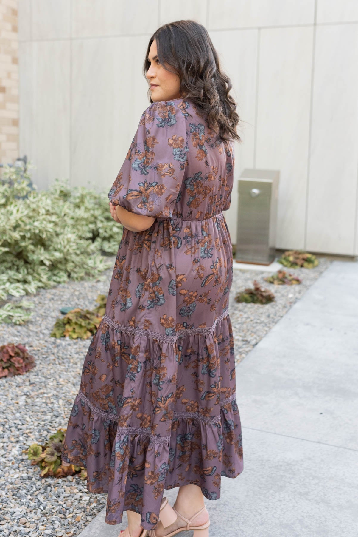 Side view of the plus size plum floral tiered dress