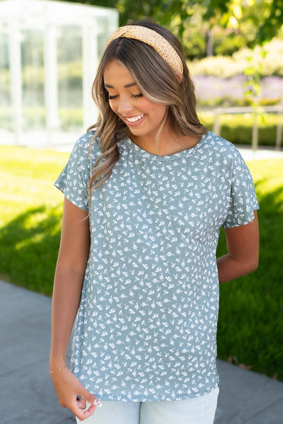 Round neck on the seafoam green floral top