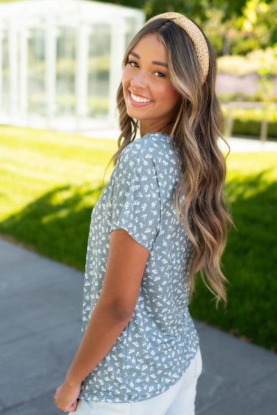 Side view of the seafoam green floral top