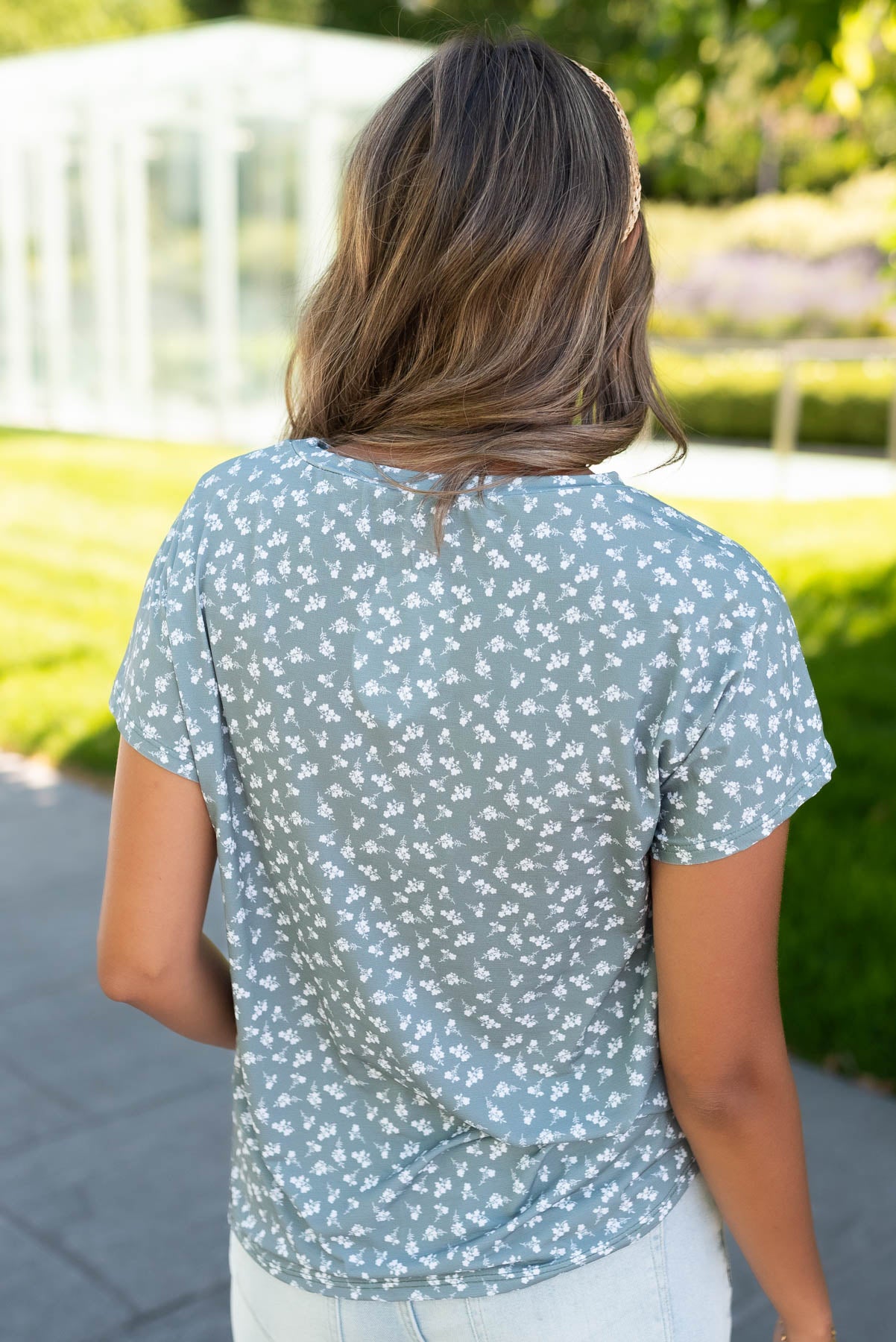 Back view of the seafoam green floral top