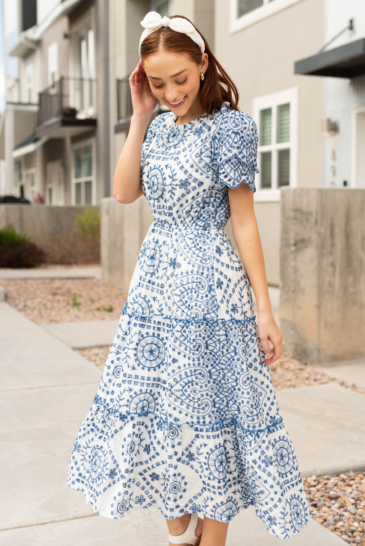 Side view of the blue embroidered dress