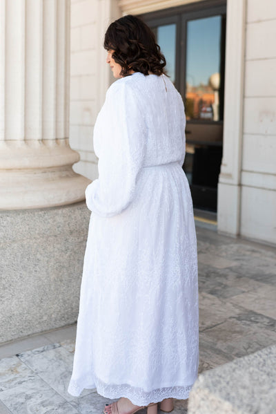 Side view of the white embroidered maxi dress