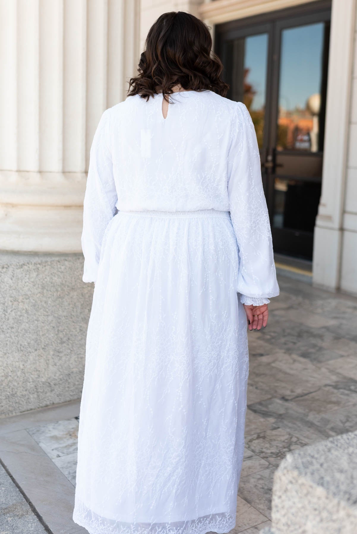 Back view of the plus size white embroidered maxi dress