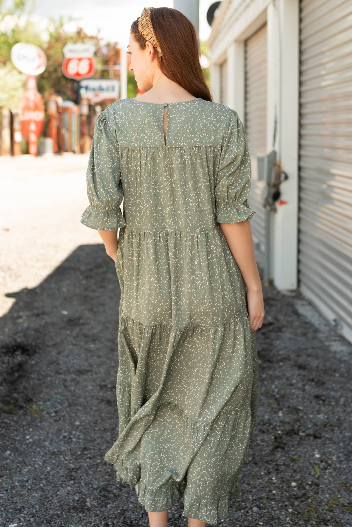 Back view of the sage floral tiered dress