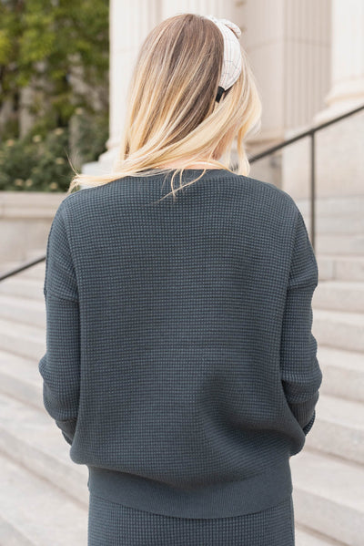 Back view of the midnight navy sweater