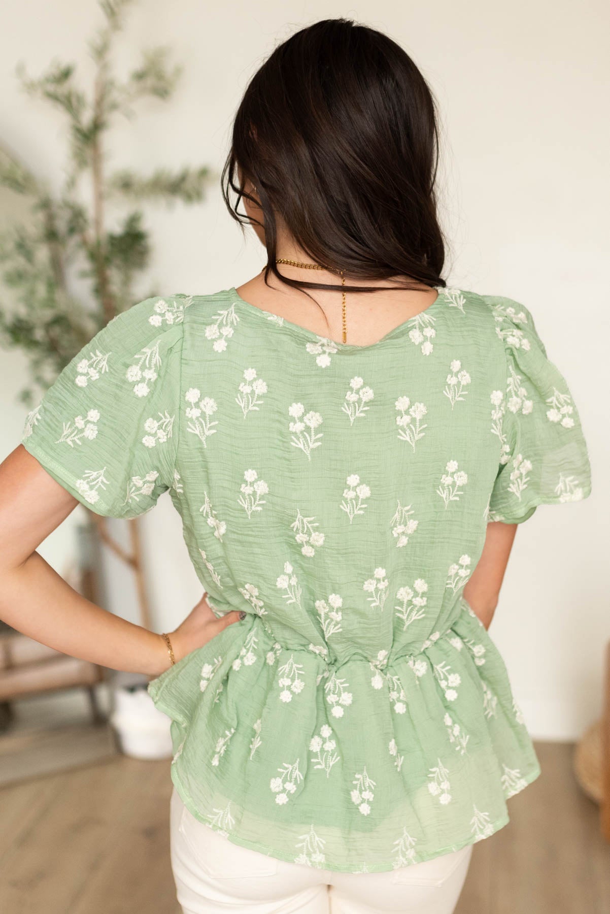 Back view of the sage floral blouse