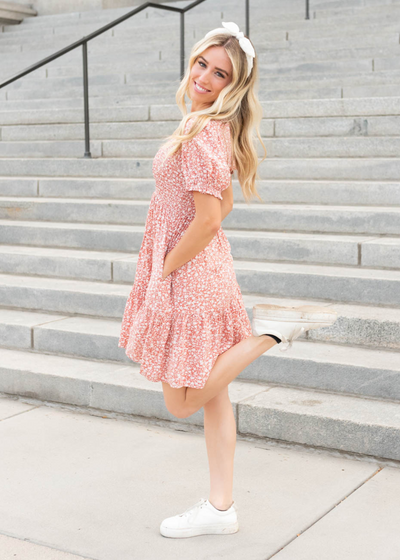 Side view of the coral floral mini dress