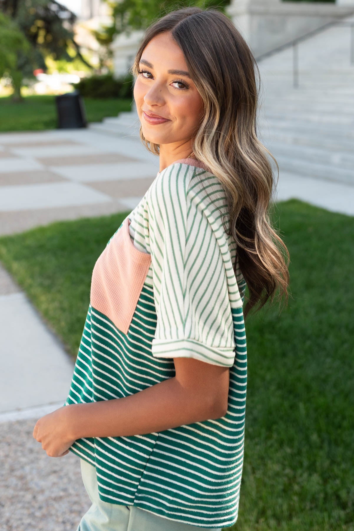 Side view of the green stirpe pocket top