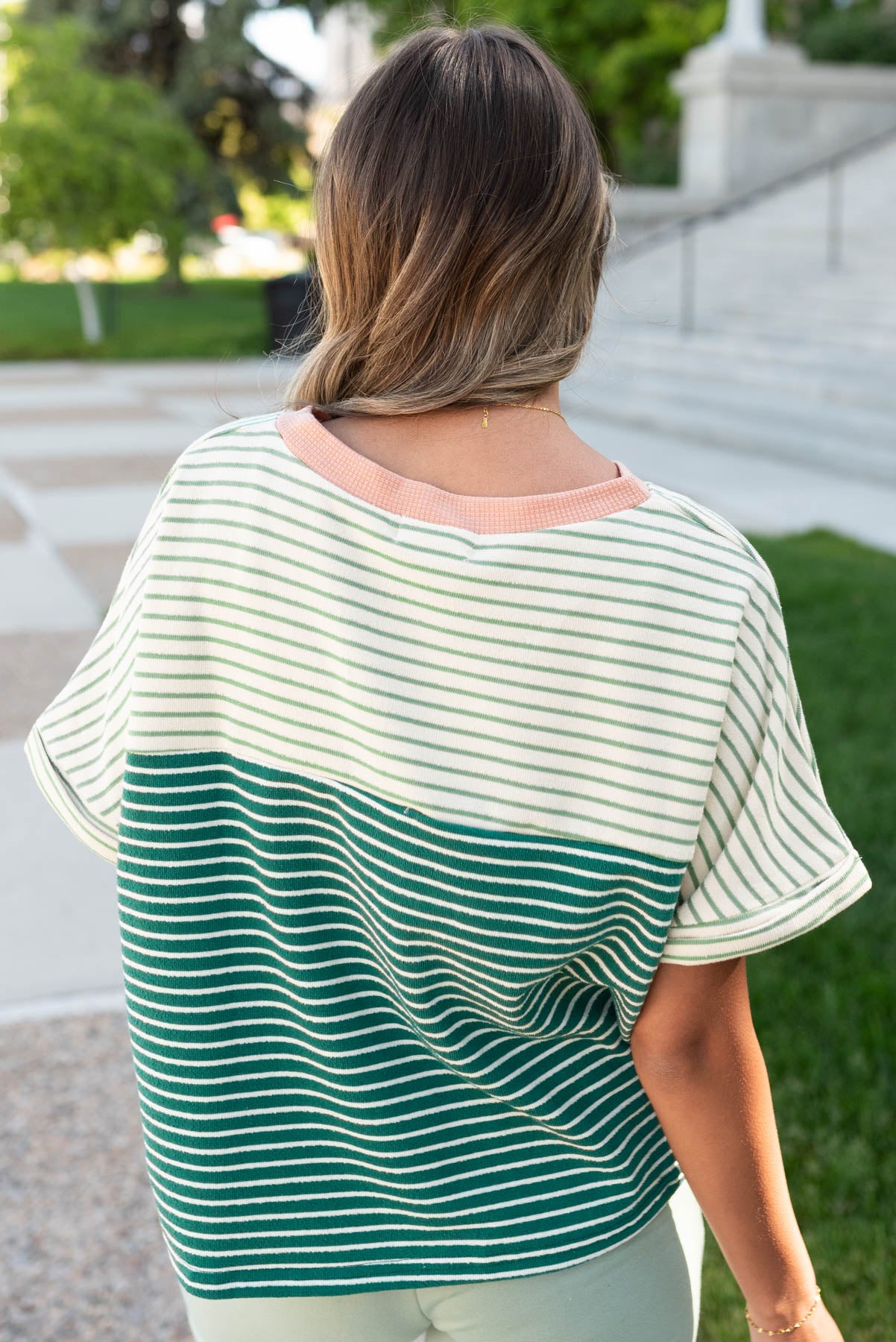 Back view of the green stripe pocket top