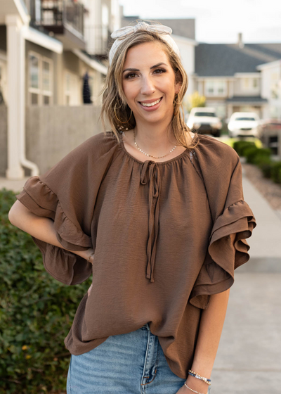 Cocoa ruffle sleeve blouse with a tie at the neck