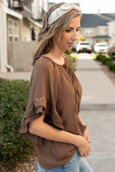 Side view of the cocoa ruffle sleeve blouse