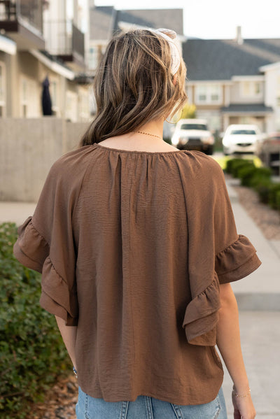 Back view of the cocoa ruffle sleeve blouse