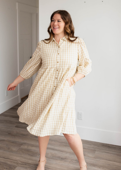 Plus size beige gingham buttondown dress with long sleeves and pockets