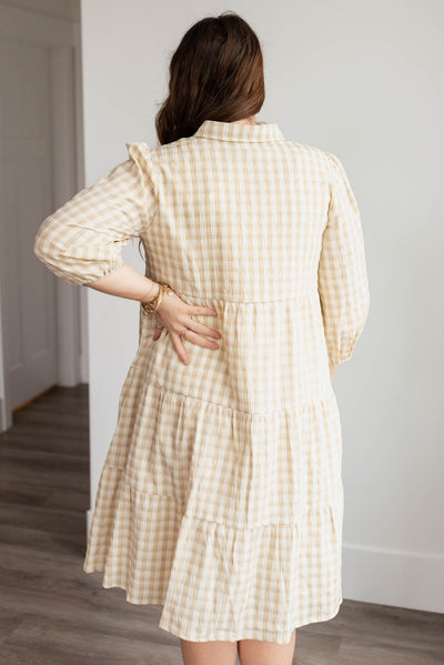 Back view of the plus size beige gingham button down dress