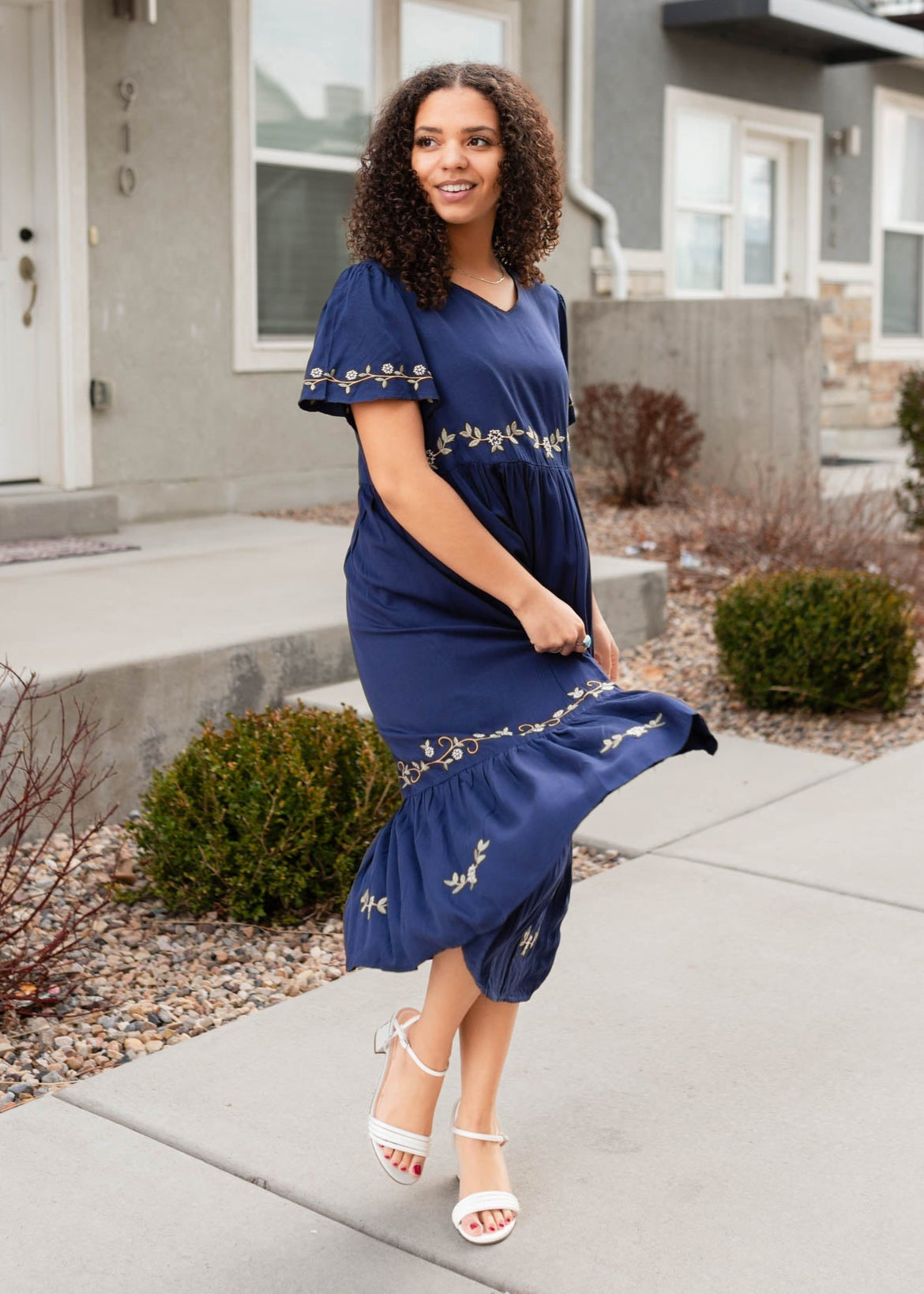 Front view of the navy embroidered dress