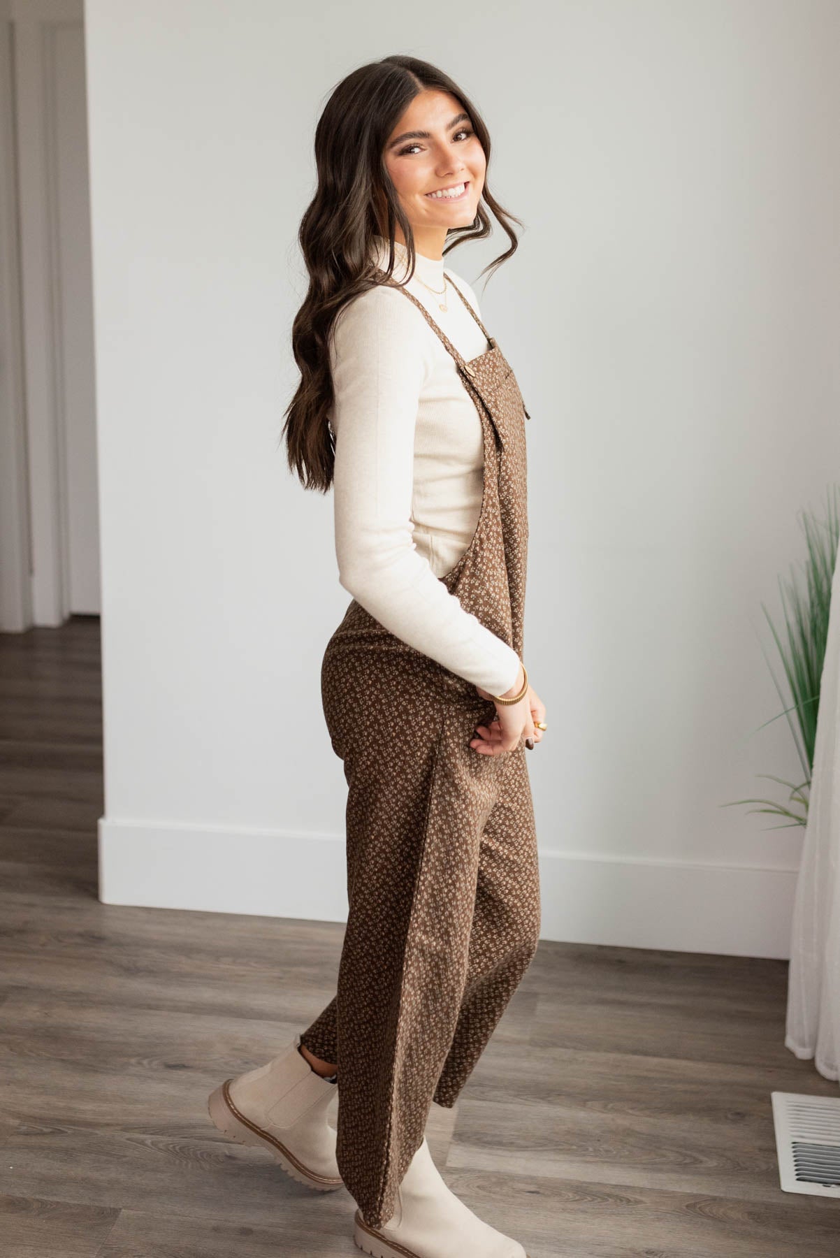 Side view of the brown floral printed overalls