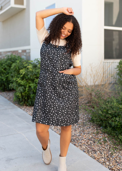 Black floral jumper dress with front pockets