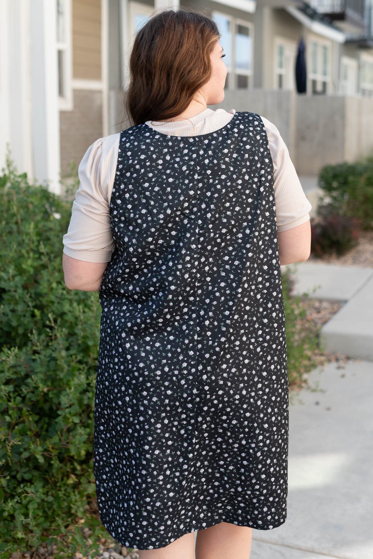 Back view of the plus size black floral jumper dress