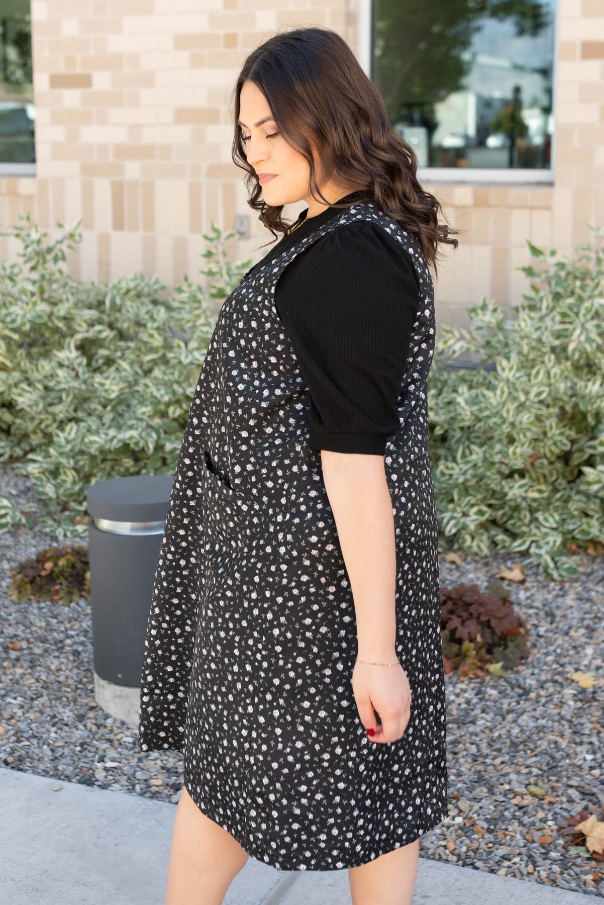 Side view of the plus size black floral jumper dress