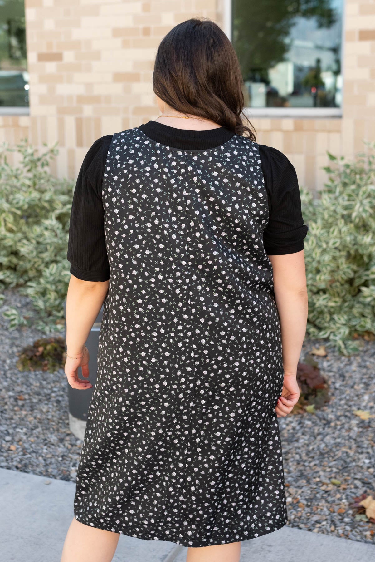 Back view of the plus size black floral jumper dress