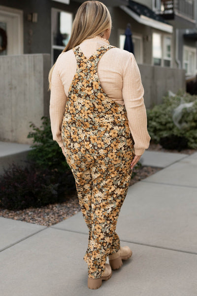 Back view of plus size floral corduroy overalls