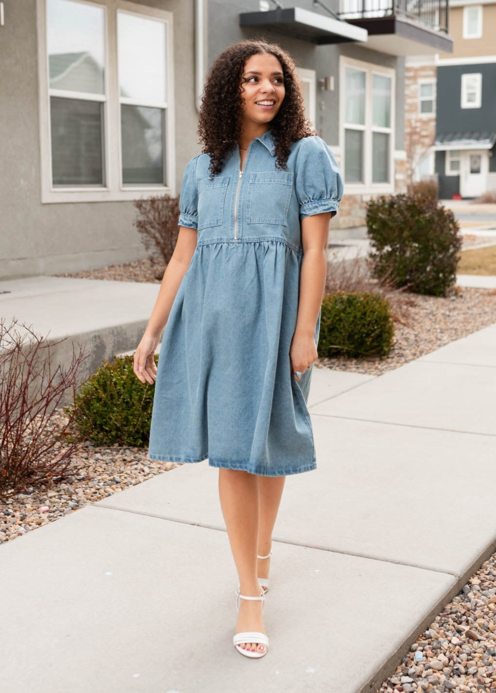 Denim zip up dress that has puff sleeves with a cuff