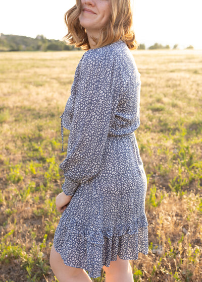 Side view of a long sleeve blue leopard dress