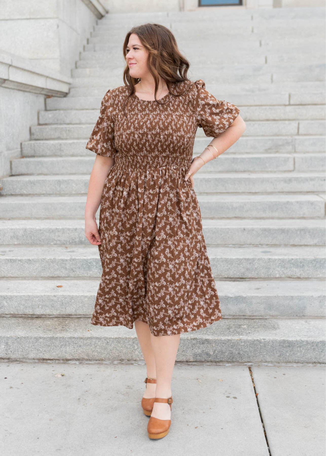 Plus size brown floral smocked dress with puff sleeves