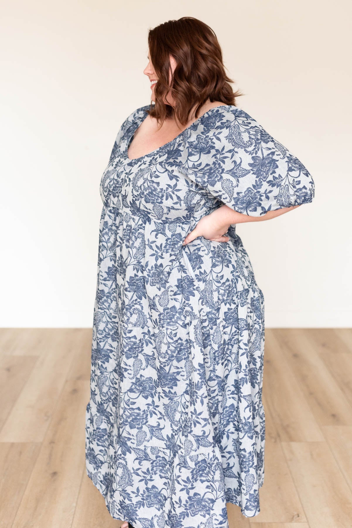 Side view of the plus size navy floral dress